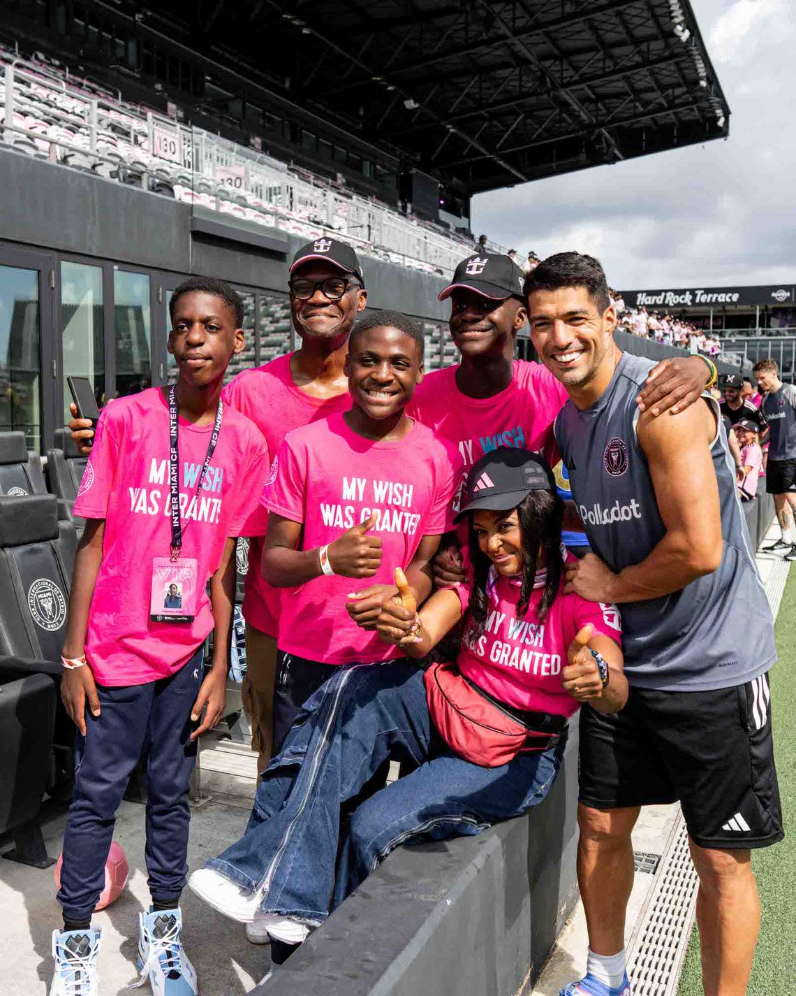 Inter Miami forward Luis Suarez (far right) poses for photos with Make-A-Wish children at Chase Stadium on Sept. 24, 2024.