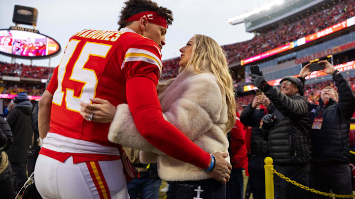 Kansas City Chiefs quarterback Patrick Mahomes (15) and wife Brittany Mahomes kiss before the AFC Championship game against the Buffalo Bills at GEHA Field at Arrowhead Stadium. Kansas City Chiefs quarterback Patrick Mahomes (15) and wife Brittany Mahomes kiss before the AFC Championship game against the Buffalo Bills at GEHA Field at Arrowhead Stadium.