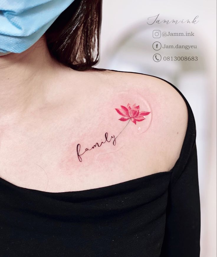 This may contain: a woman with a tattoo on her shoulder that reads family and has a flower in it