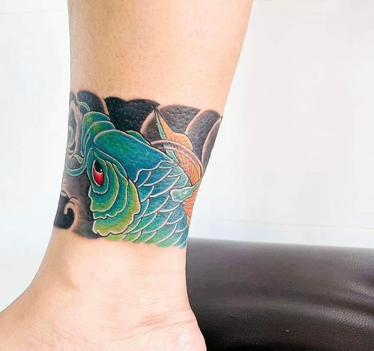 Fish ankle tattoo, symbolizing flexibility and adaptability