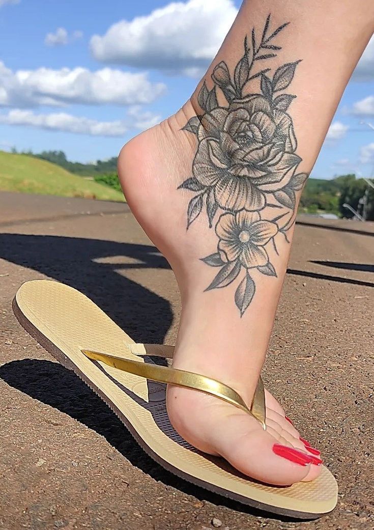 Flower ankle tattoo under the shimmering sunlight, bringing bright and radiant beauty