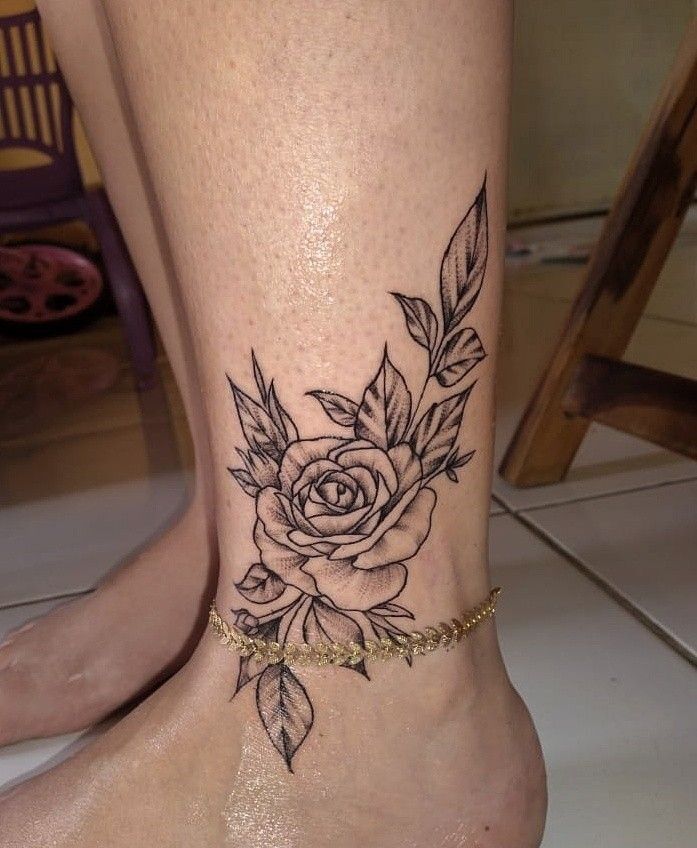 Small flower ankle tattoo, simple but elegant