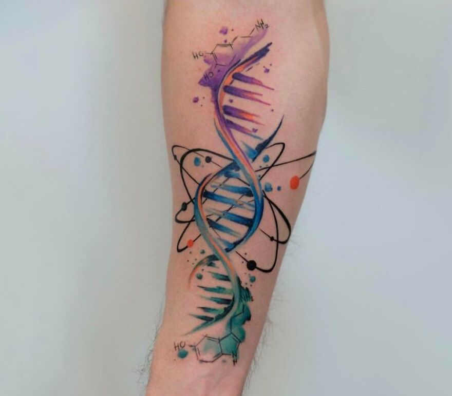 Colorful DNA watercolor tattoo design on forearm with galaxy elements and chemical structures. Colorful DNA watercolor tattoo design on forearm with galaxy elements and chemical structures.