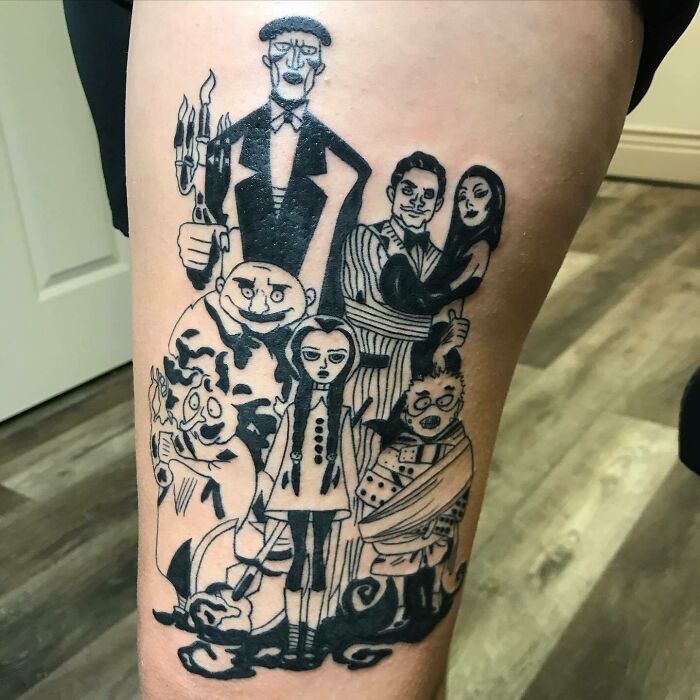Family tattoo of cartoon characters symbolizing unbreakable bonds on leg. Family tattoo of cartoon characters symbolizing unbreakable bonds on leg.