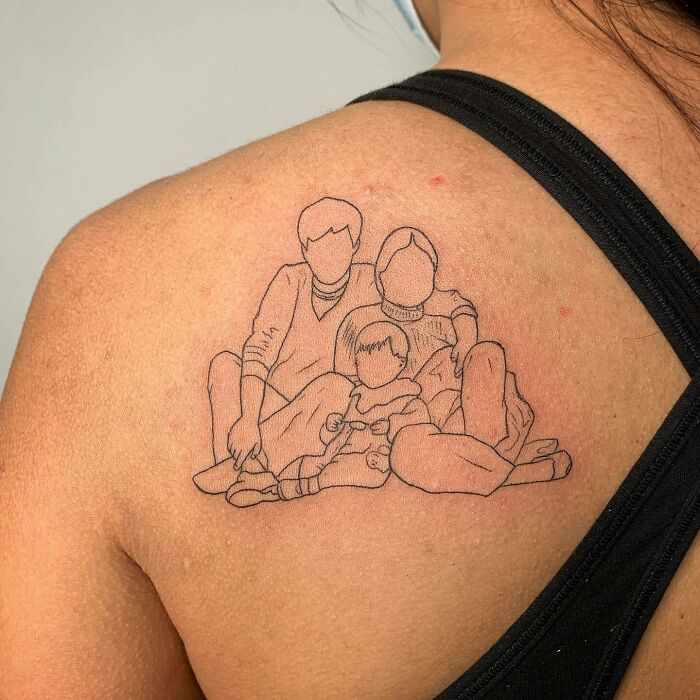 Family tattoo on shoulder depicting three figures, symbolizing unbreakable bonds. Family tattoo on shoulder depicting three figures, symbolizing unbreakable bonds.