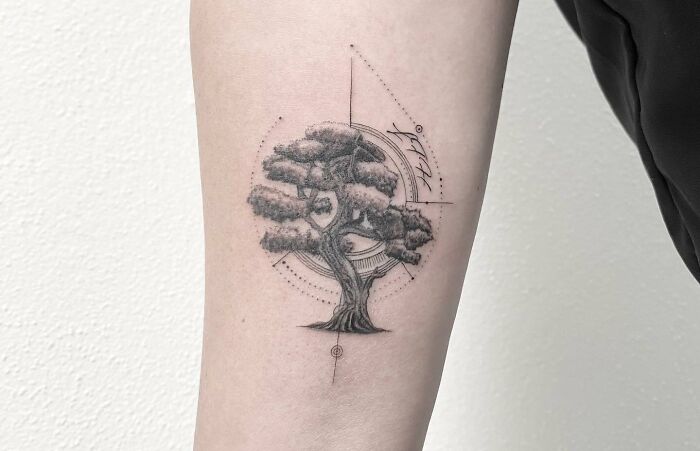 Tree tattoo symbolizing unbreakable family bonds on an arm, featuring geometric details and shading. Tree tattoo symbolizing unbreakable family bonds on an arm, featuring geometric details and shading.
