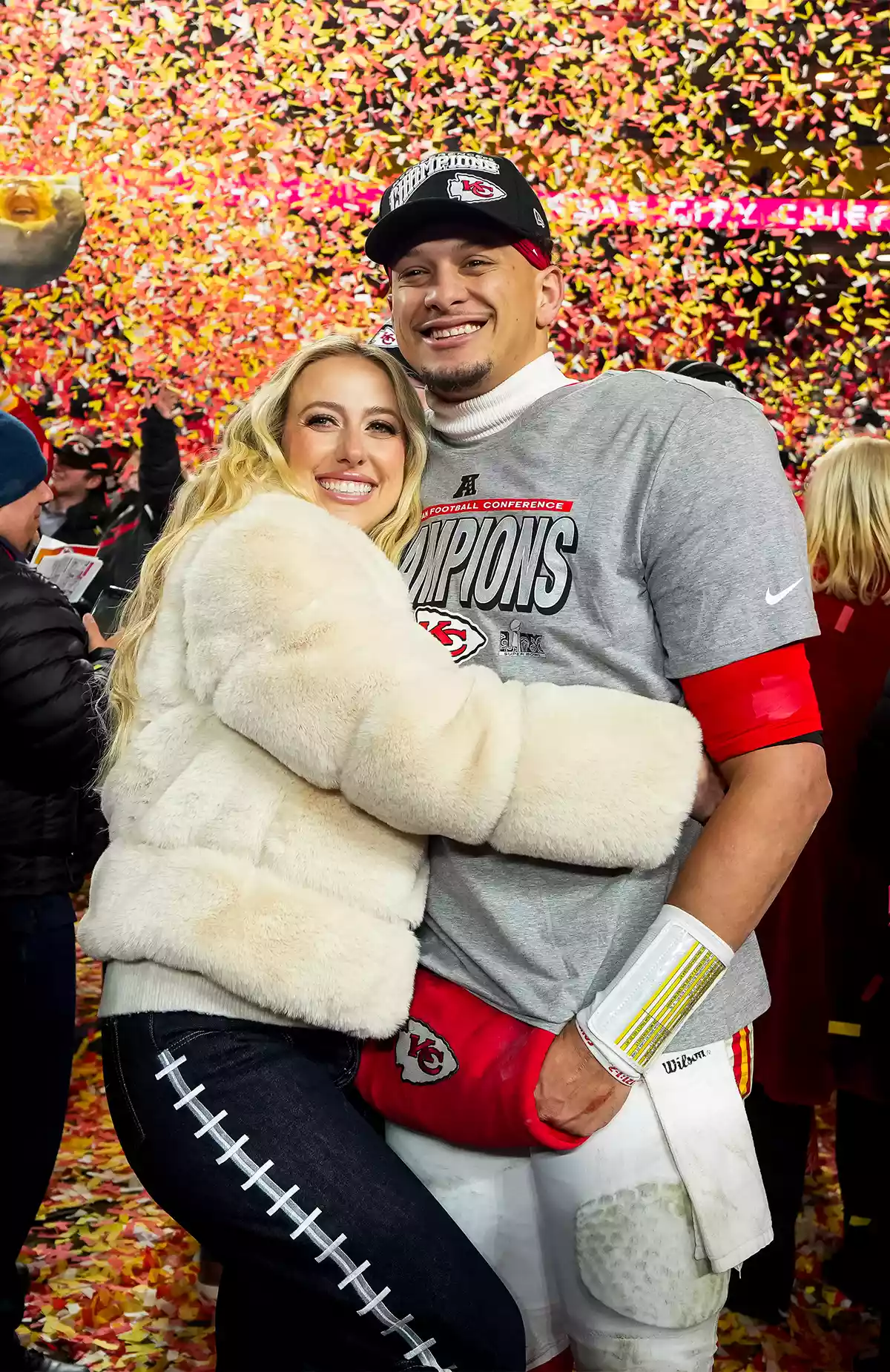Quarterback Patrick Mahomes #15 of the Kansas City Chiefs poses for a photo with his wife Brittany Mahomes after the AFC Championship game against the Buffalo Bills, at GEHA Field at Arrowhead Stadium on January 26, 2025 in Kansas City, Missouri.