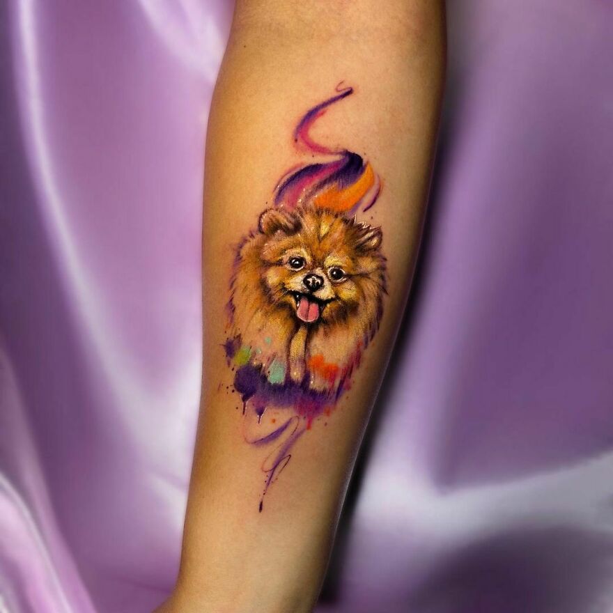 Watercolor tattoo of a dog on forearm, featuring vibrant colors and artistic brushstroke effects. Watercolor tattoo of a dog on forearm, featuring vibrant colors and artistic brushstroke effects.