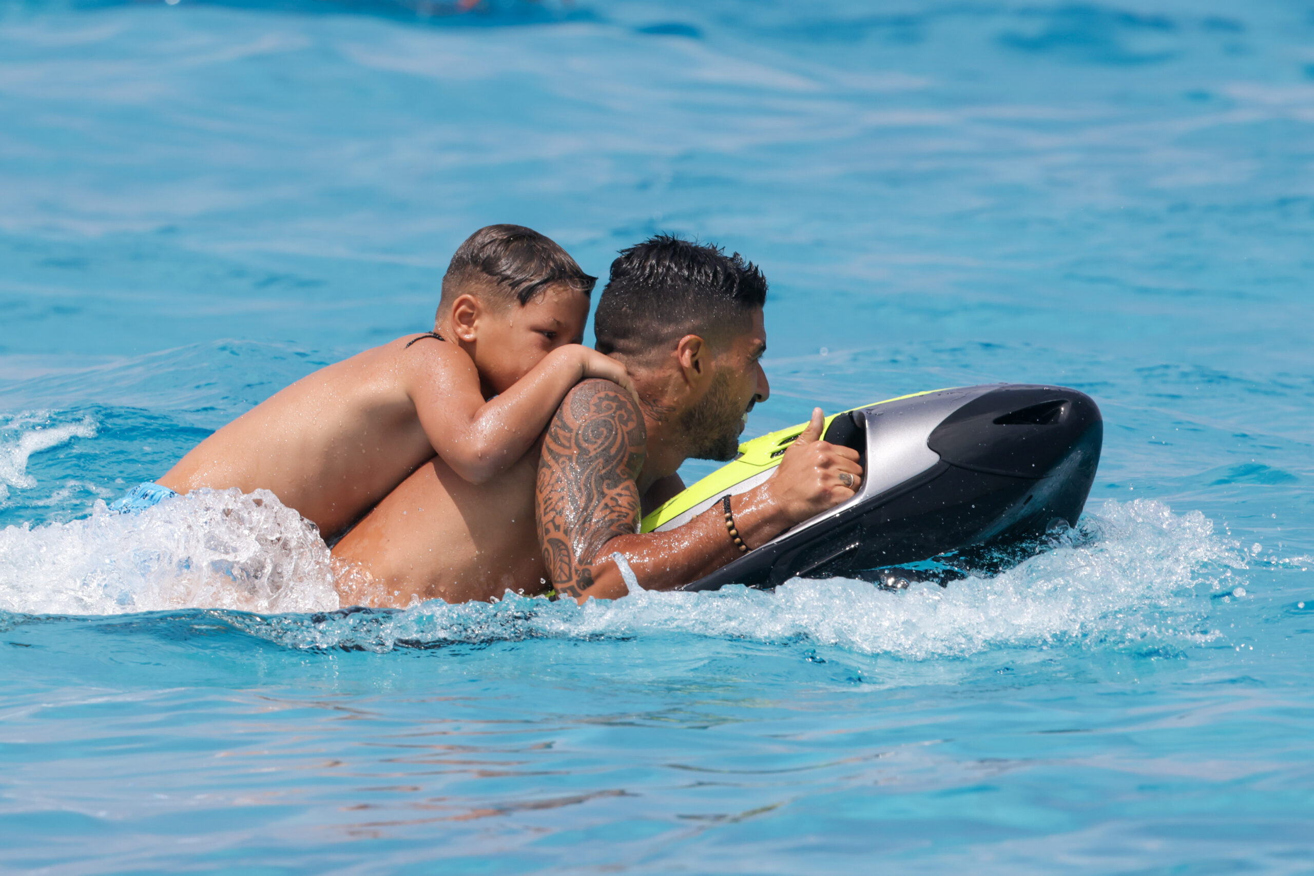 Luis Suarez and his family are once again holidaying with the Messi clan