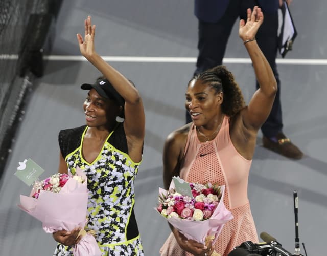 Stretch it out: Serena, Venus Williams offer fans yoga tips