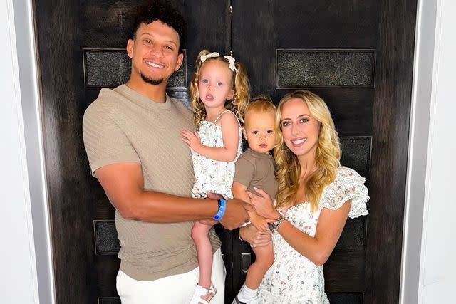 Brittany Mahomes/Instagram Patrick Mahomes smiles with wife Brittany Mahomes and their two children in May 2024.