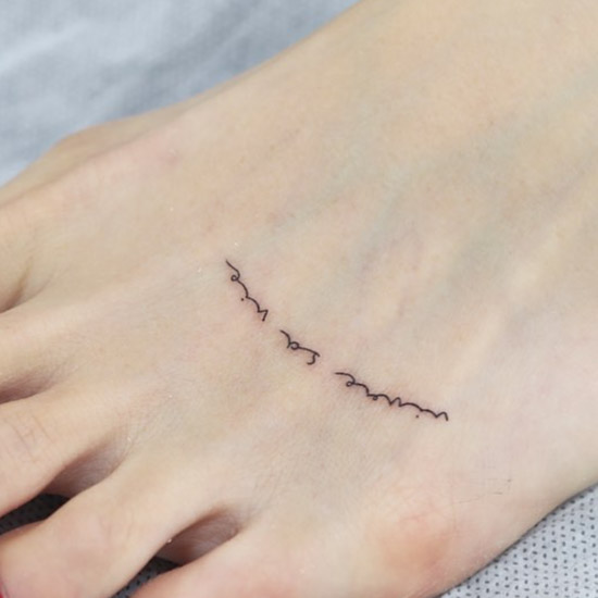 tiny foot quote tattoo