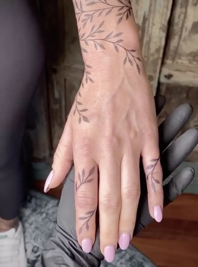 Vine hand tattoo that extends from wrist to fingers
